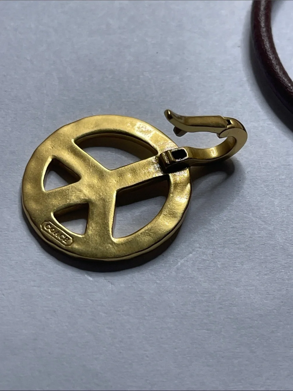 Coach Brown Leather Bracelet with Gold Peace Charm